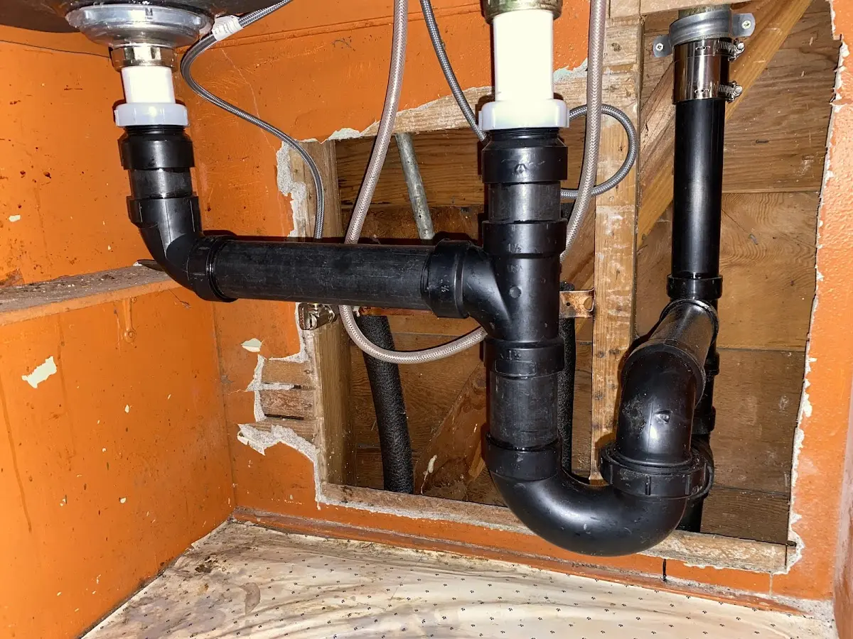 Professional Garbage Disposal Repair equipment and tools on the job in Holiday Shores